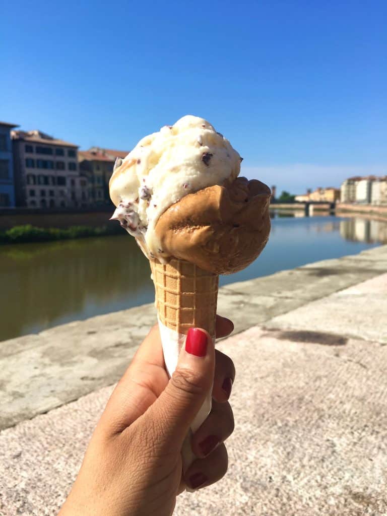 One day in Pisa: Bejal holding Ice-cream overlooking the River Arno