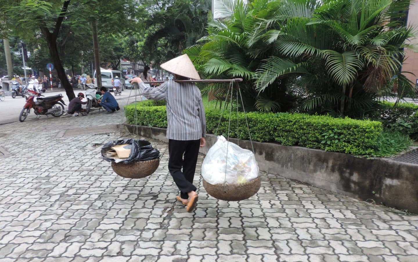 Lady carrying plastic in Hanoi