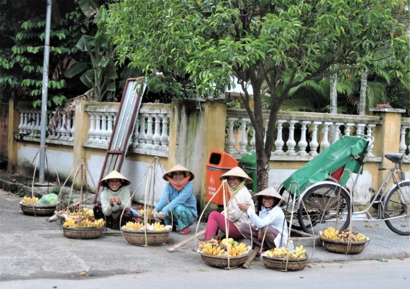 Fruit seleer ladies sitting outside in Hoi An town