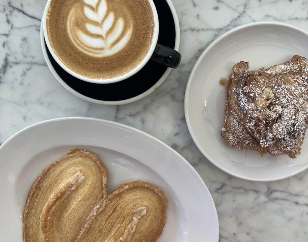 Palmier, latte and Almond Croissant at Tatte