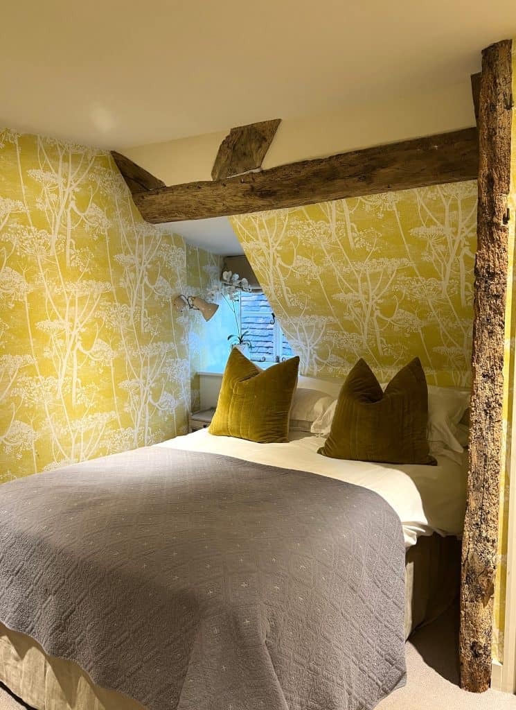 The Falstaff cosy room with bed and scatter cushions