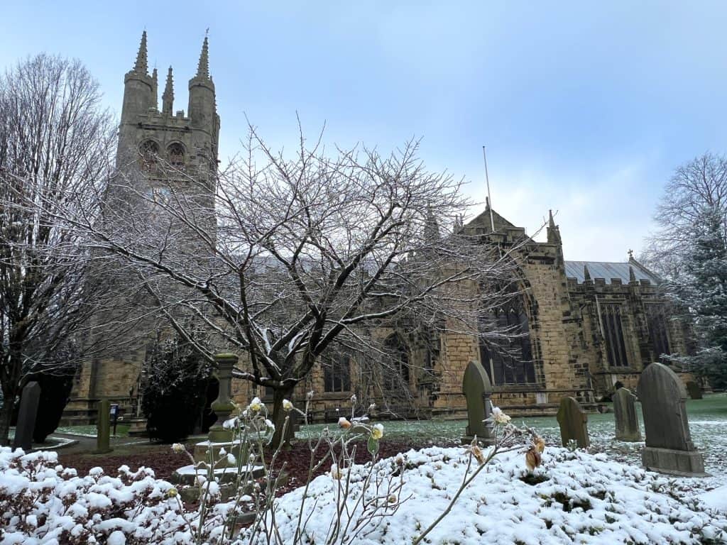 St John the Baptist Church exterior in snow, Tideswell during a stay at The Merchant's Yard