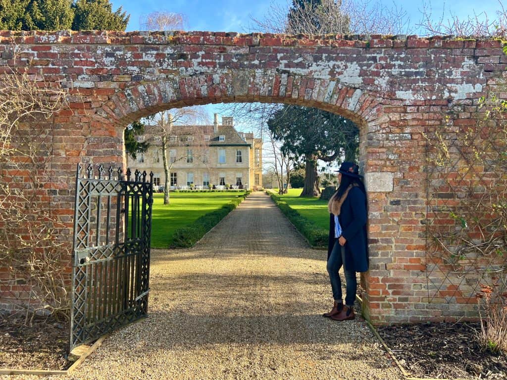 Bejal looking at Stapleford Park from walled garden entrance