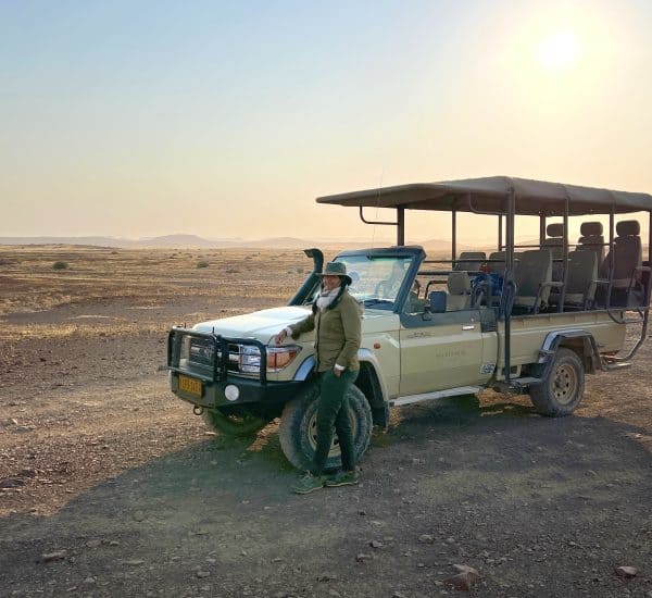 Bejal standing with Safari Car in Damaraland