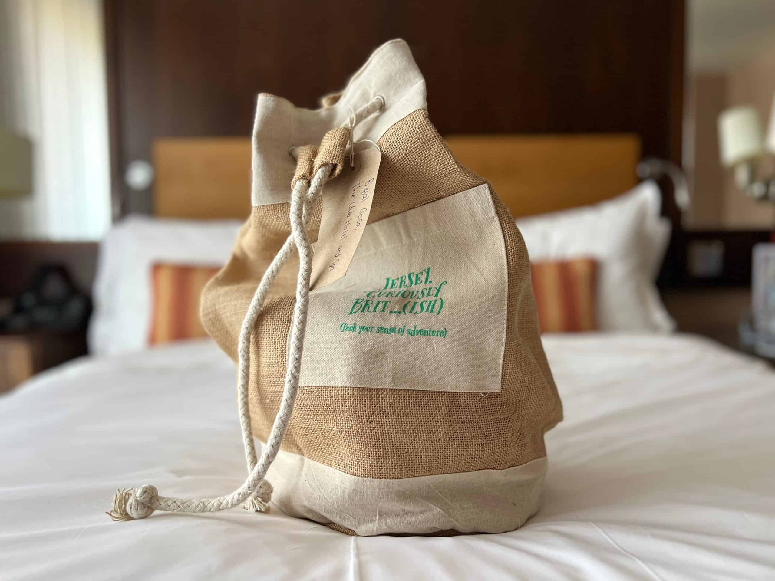 Sustainable Jersey: Visit Jersey hessian bag on bed