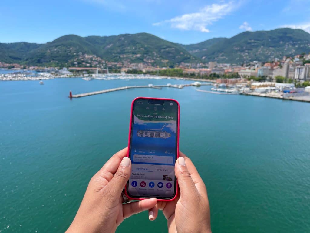 First-time cruise guide: Royal Caribbean app on phone with view of La Spezia